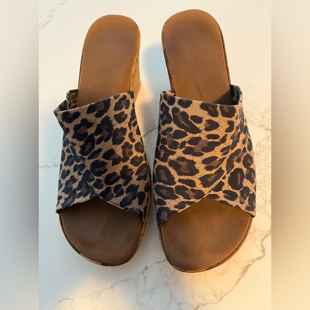 These animal print wedges are a gently used Size 7 (38).